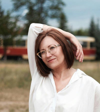 Woman with arms raised over head